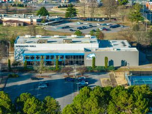 Aerial view of the exterior of The University of Alabama in Huntsville's Spragins Hall Gymnasium, Taken via Drone by The Highland Group